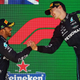 Race winner George Russell of Great Britain and Mercedes and Second placed Lewis Hamilton of Great Britain and Mercedes celebrate on the podium during the F1 Grand Prix of Brazil at Autodromo Jose Carlos Pace on November 13, 2022 in Sao Paulo, Brazil.